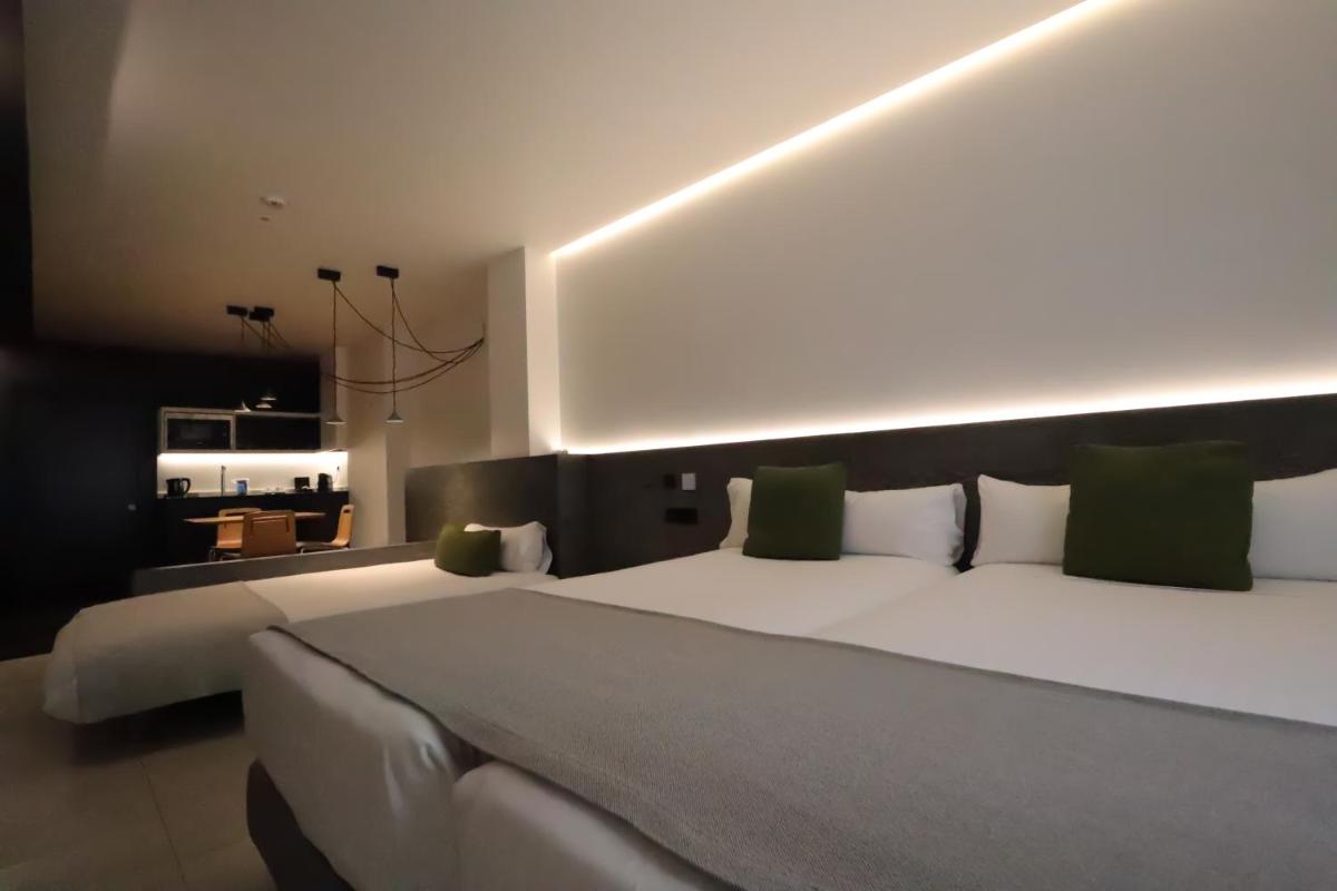 Cama o camas de una habitación en MYR Plaza Mercado & Spa