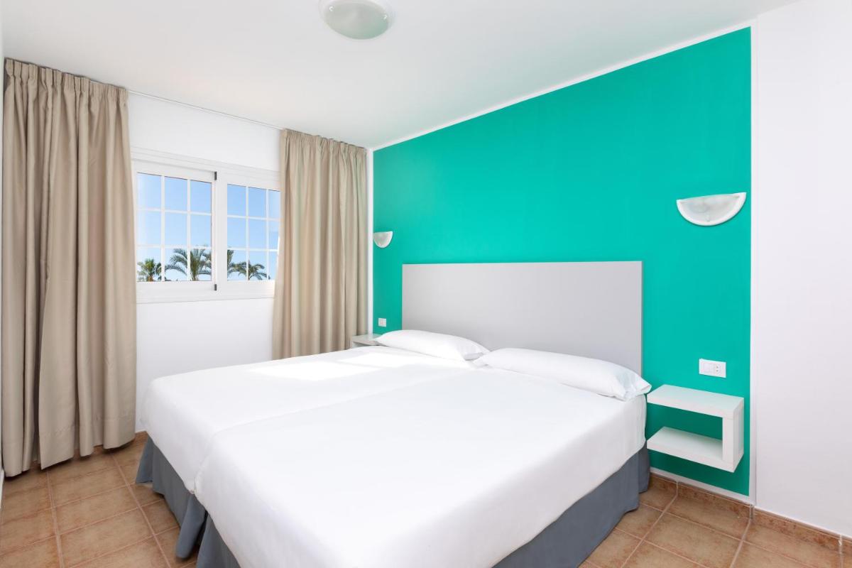 Cama o camas de una habitación en Chatur Playa Real Resort