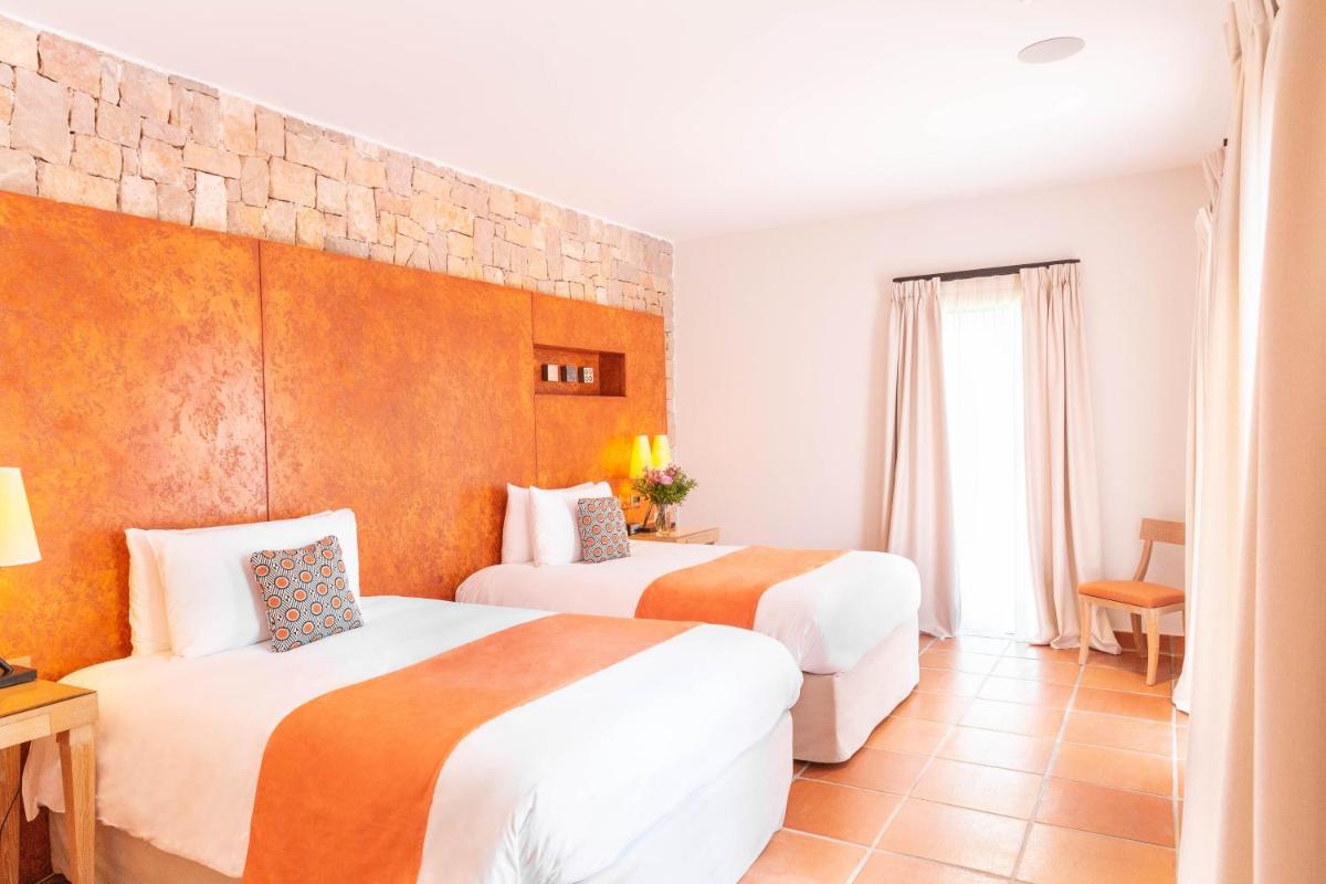 Un ou plusieurs lits dans un hébergement de l'établissement Terre Blanche Hotel Spa Golf Resort