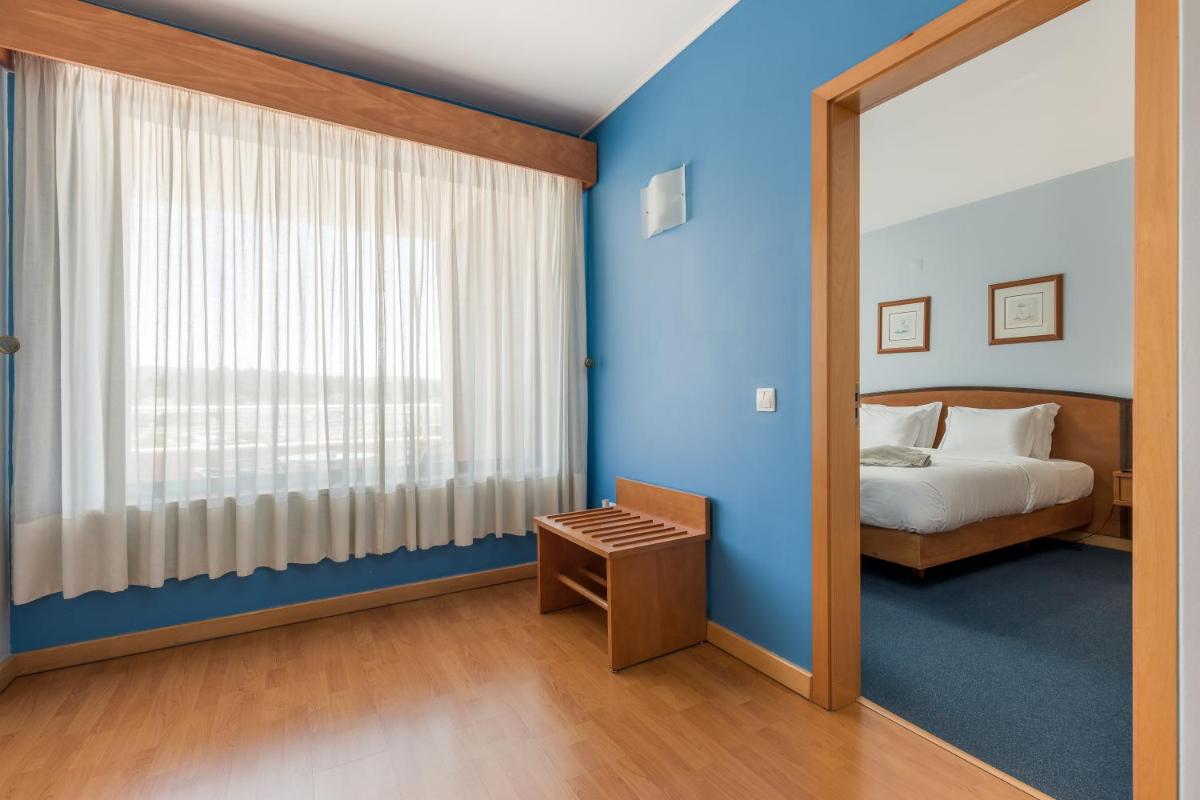 Uma cama ou camas num quarto em Hotel Do Parque - Congress & SPA