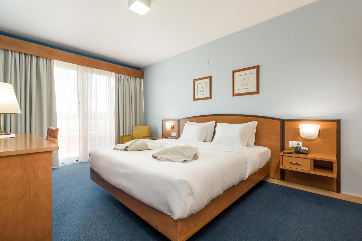 Uma cama ou camas num quarto em Hotel Do Parque - Congress & SPA