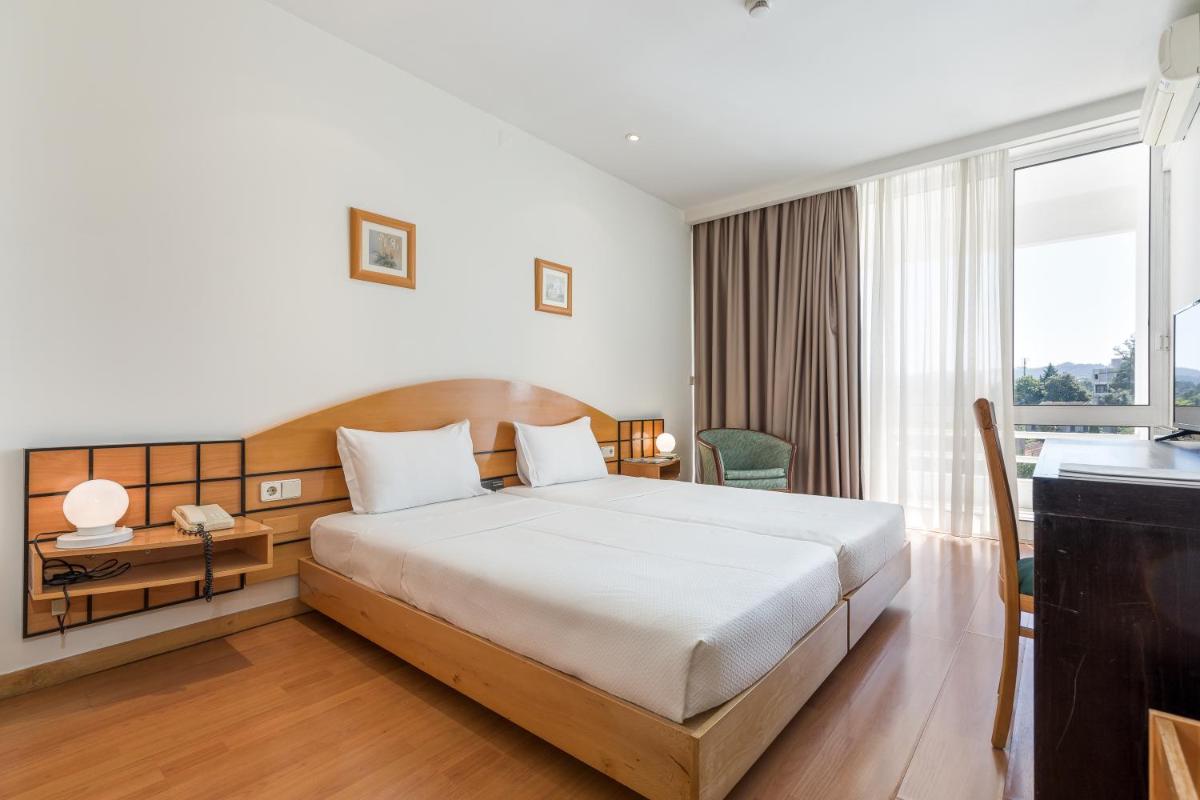 Uma cama ou camas num quarto em Hotel Do Parque - Congress & SPA