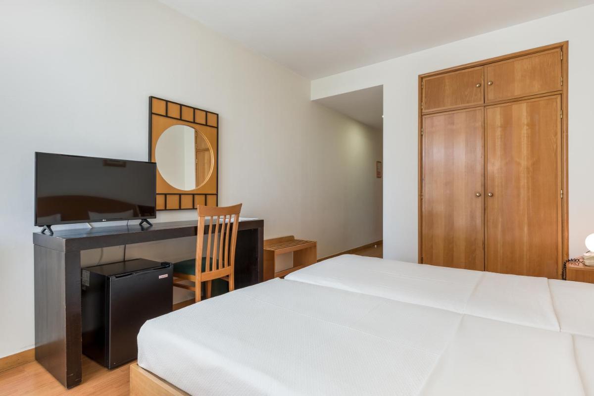 Uma cama ou camas num quarto em Hotel Do Parque - Congress & SPA