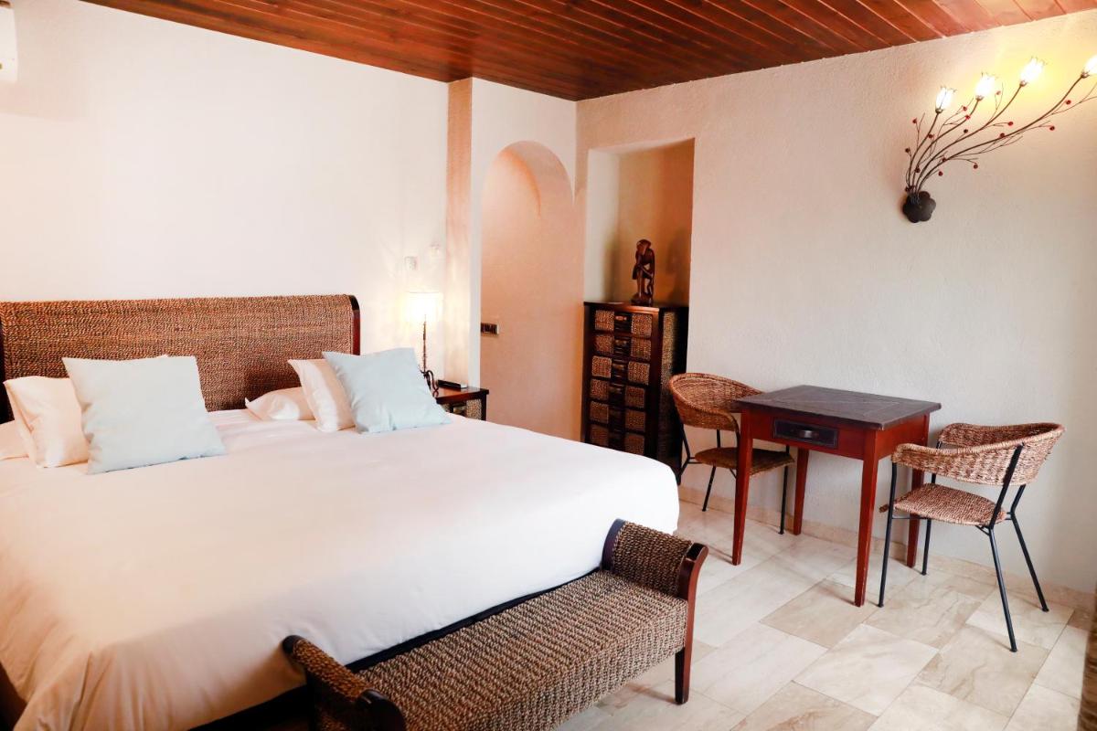 Cama o camas de una habitación en La Violeta HOTEL SPA & CHILL OUT