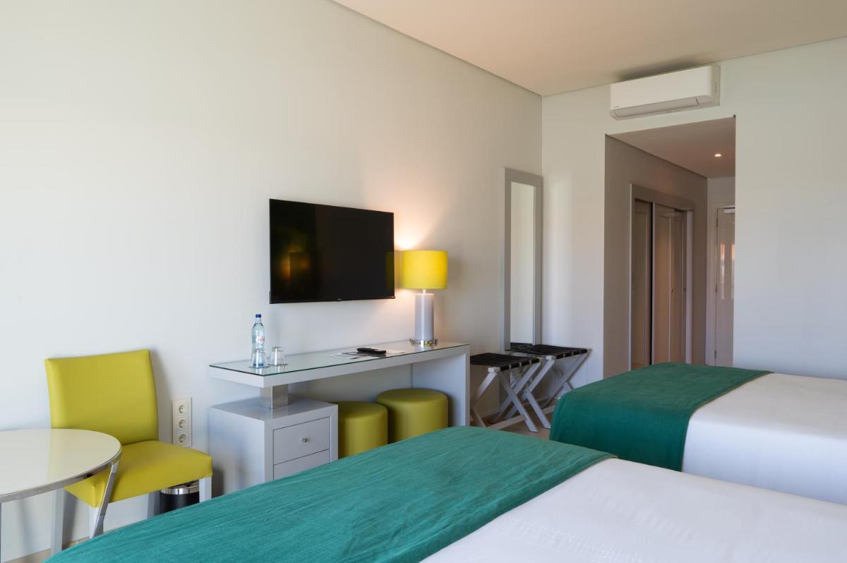 Uma cama ou camas num quarto em Vila Gale Nep Kids