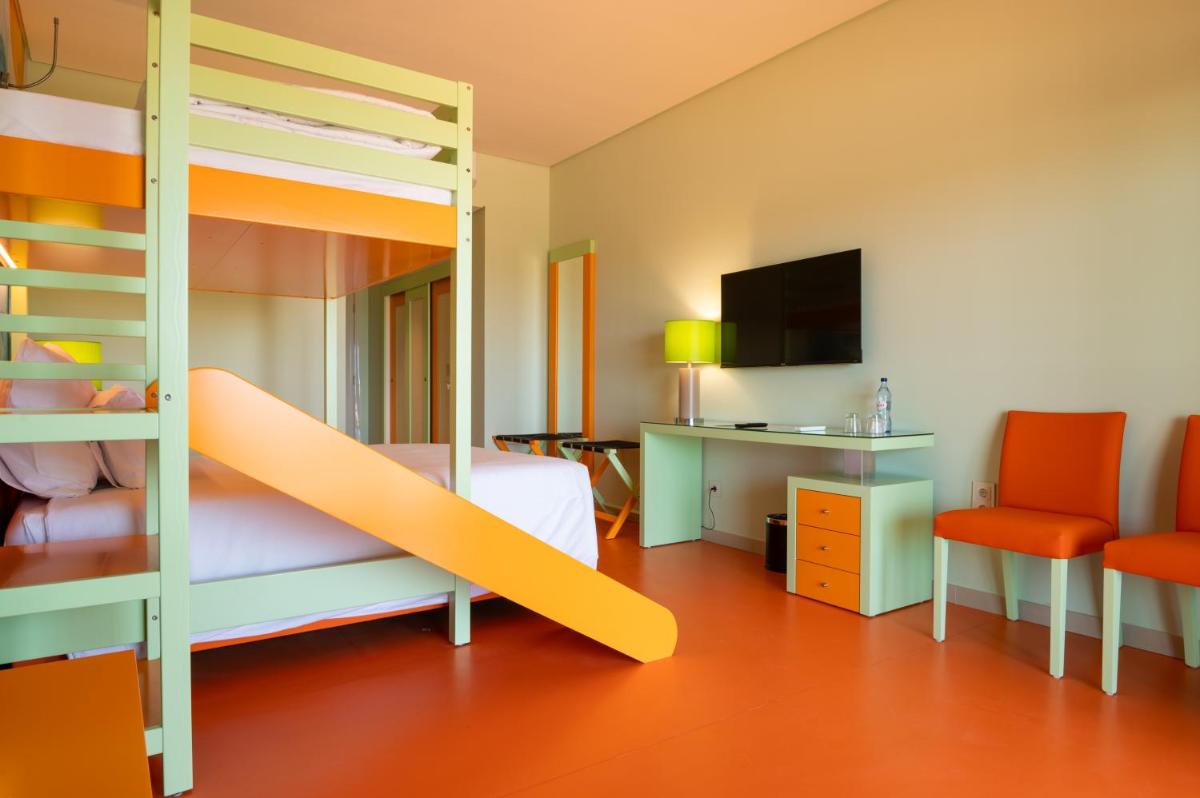 Uma cama ou camas num quarto em Vila Gale Nep Kids