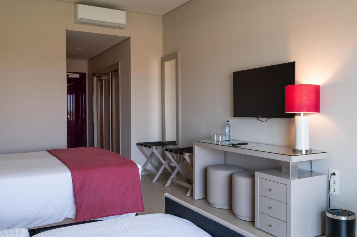 Uma cama ou camas num quarto em Vila Gale Nep Kids