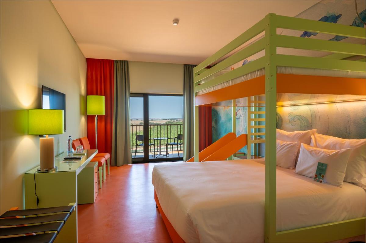 Uma cama ou camas num quarto em Vila Gale Nep Kids