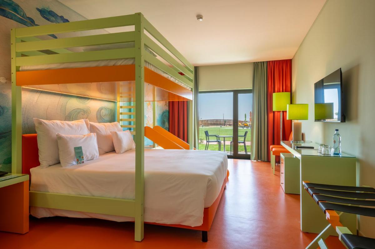 Uma cama ou camas num quarto em Vila Gale Nep Kids