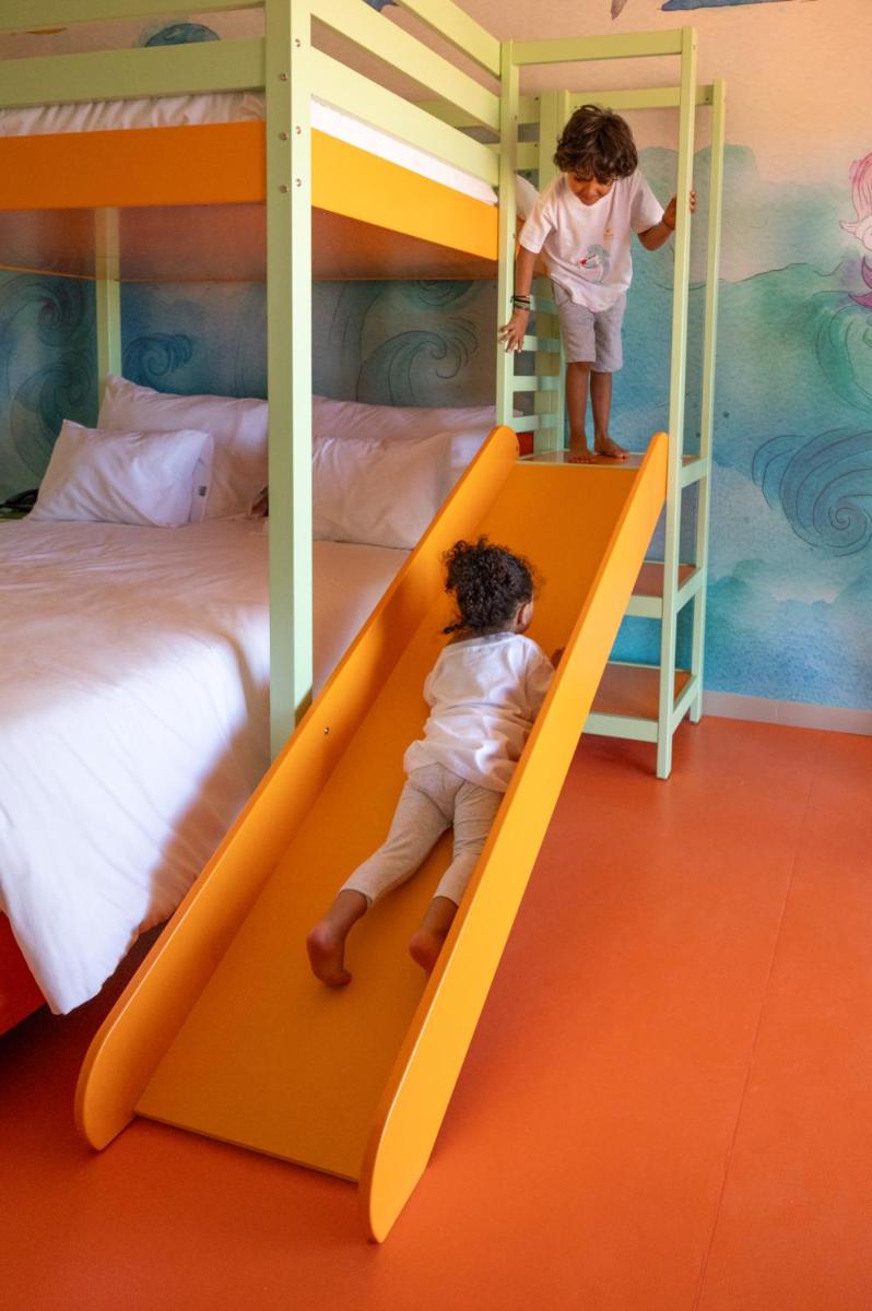Uma cama ou camas num quarto em Vila Gale Nep Kids