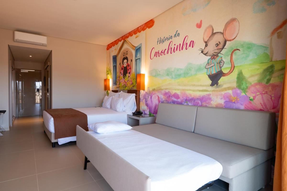 Uma cama ou camas num quarto em Vila Gale Nep Kids