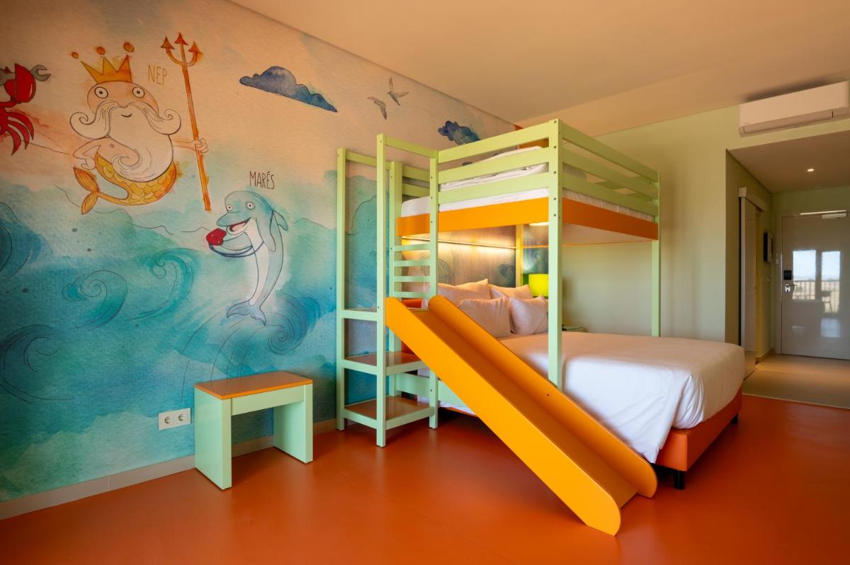 Uma cama ou camas num quarto em Vila Gale Nep Kids