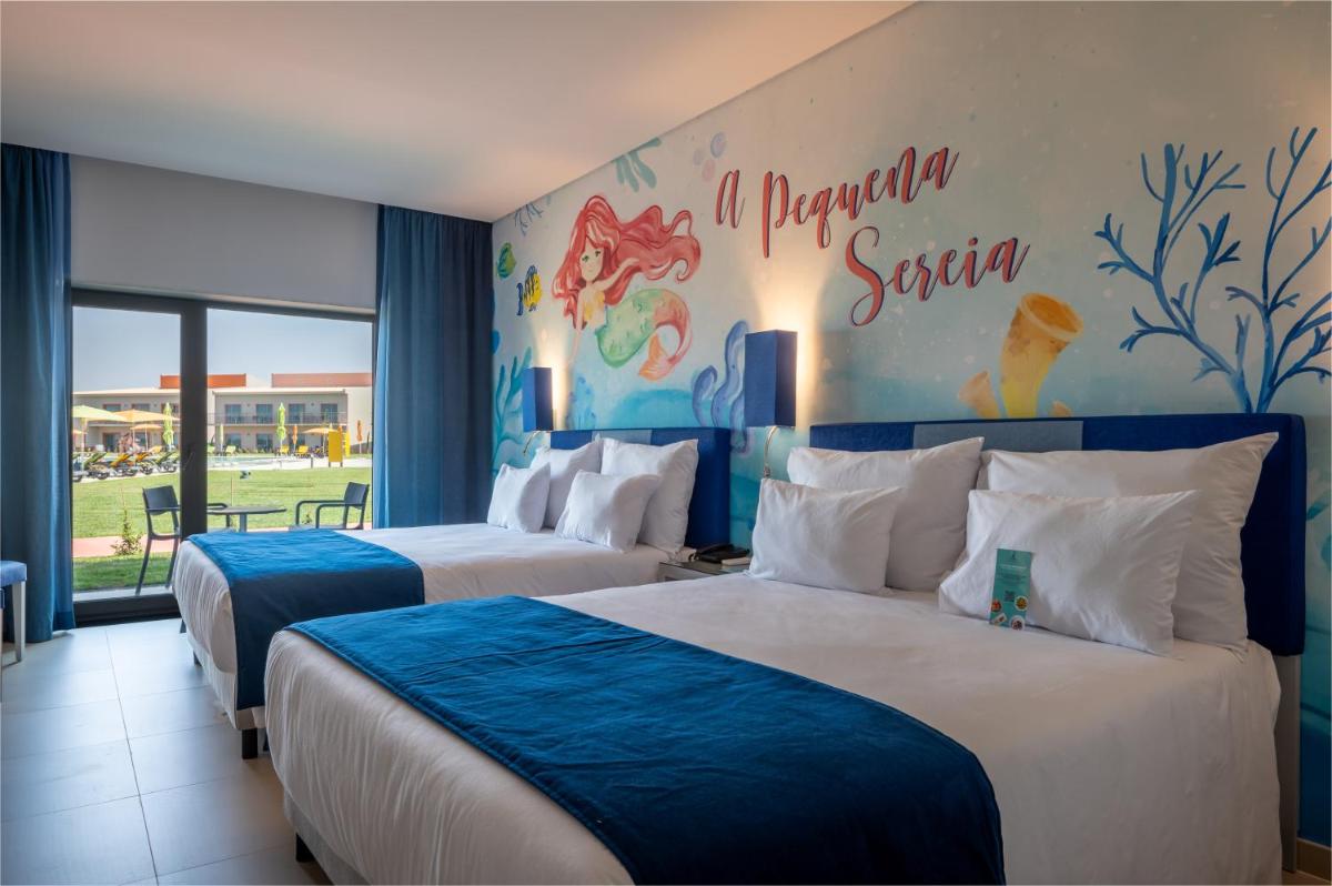 Uma cama ou camas num quarto em Vila Gale Nep Kids