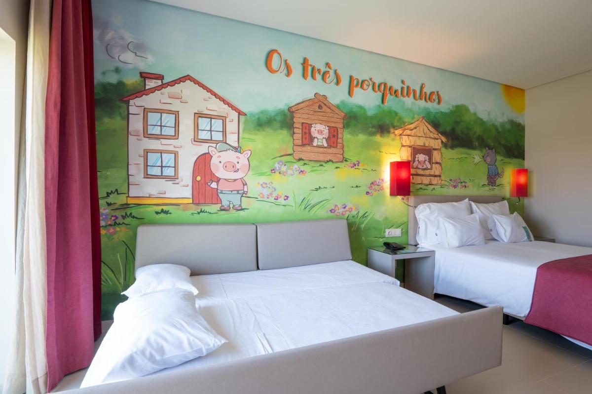 Uma cama ou camas num quarto em Vila Gale Nep Kids