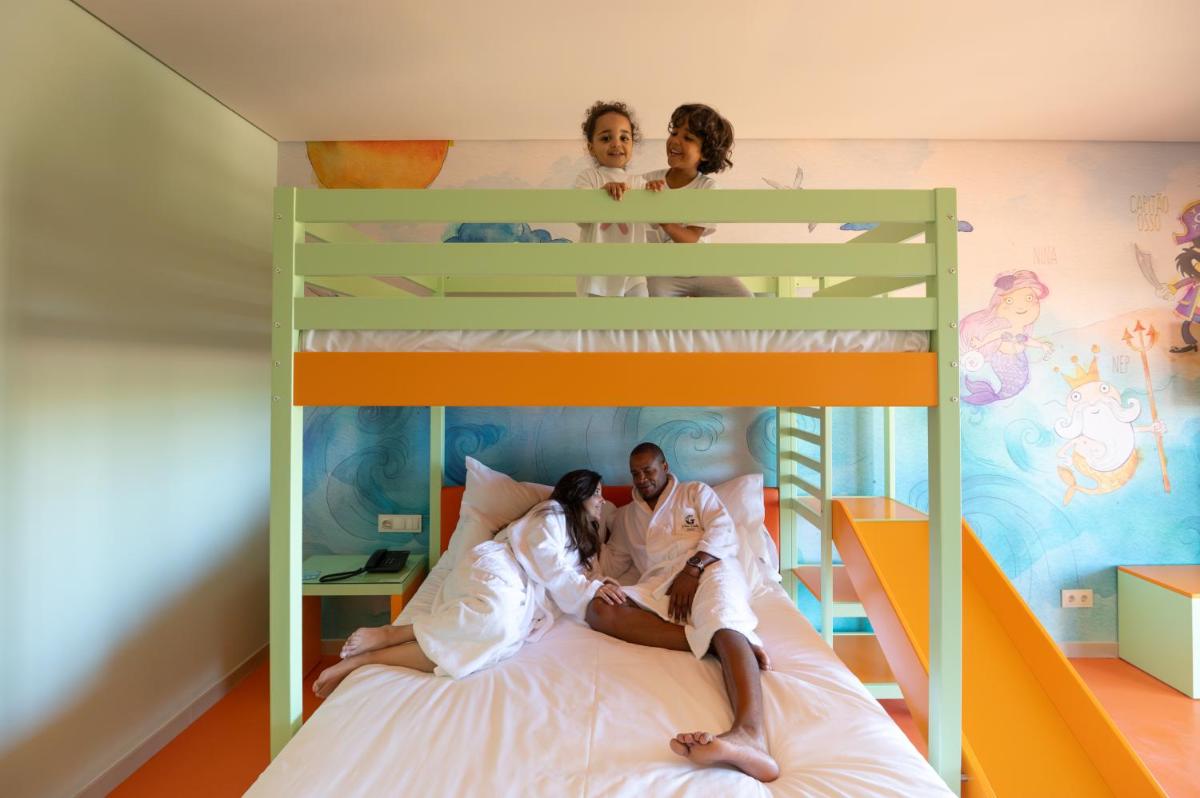 Uma cama ou camas num quarto em Vila Gale Nep Kids