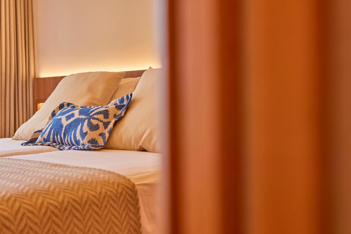 Cama o camas de una habitación en Universal Grand León & Spa