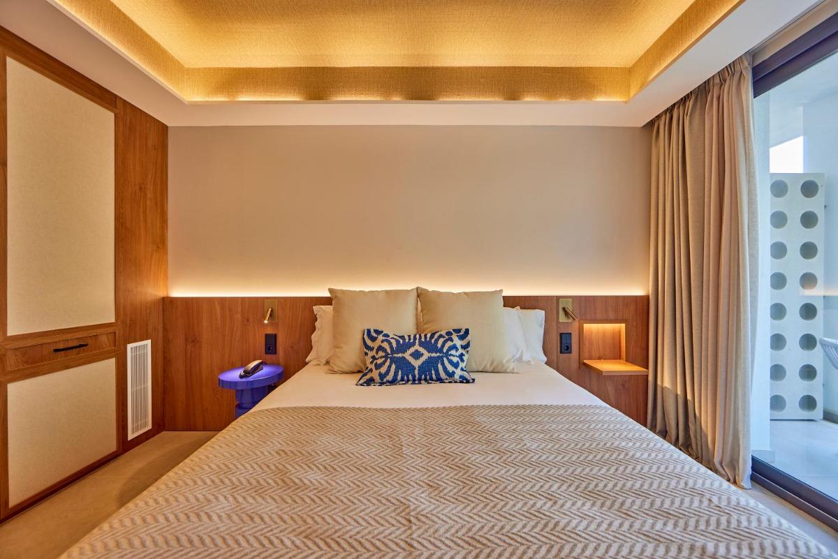 Cama o camas de una habitación en Universal Grand León & Spa