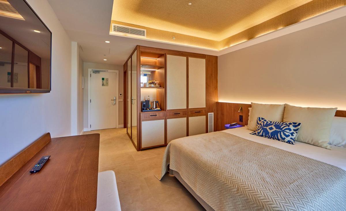 Cama o camas de una habitación en Universal Grand León & Spa