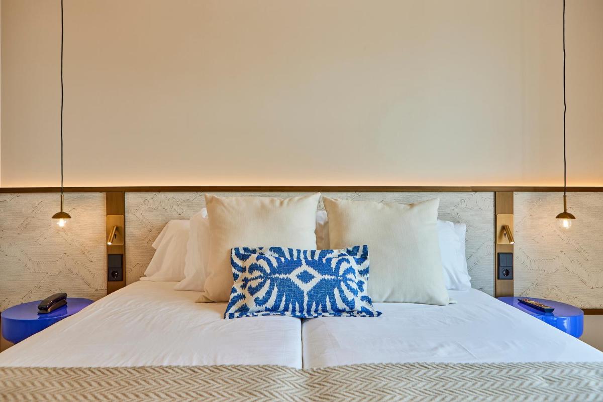 Cama o camas de una habitación en Universal Grand León & Spa