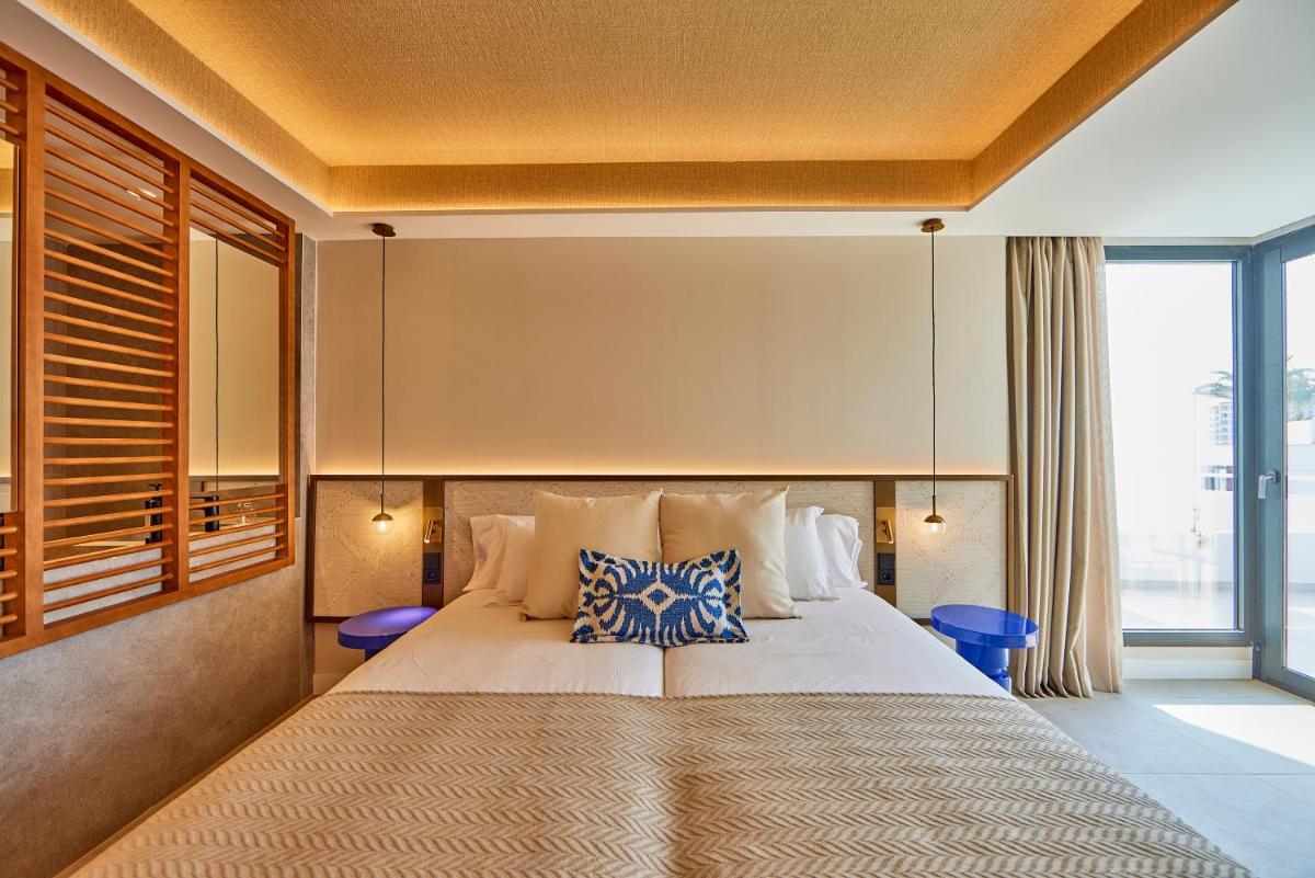 Cama o camas de una habitación en Universal Grand León & Spa