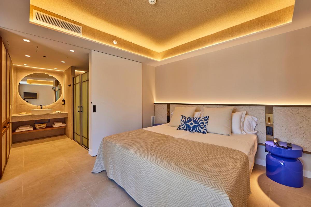 Cama o camas de una habitación en Universal Grand León & Spa