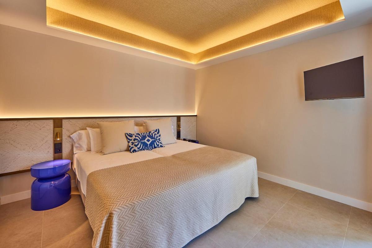 Cama o camas de una habitación en Universal Grand León & Spa