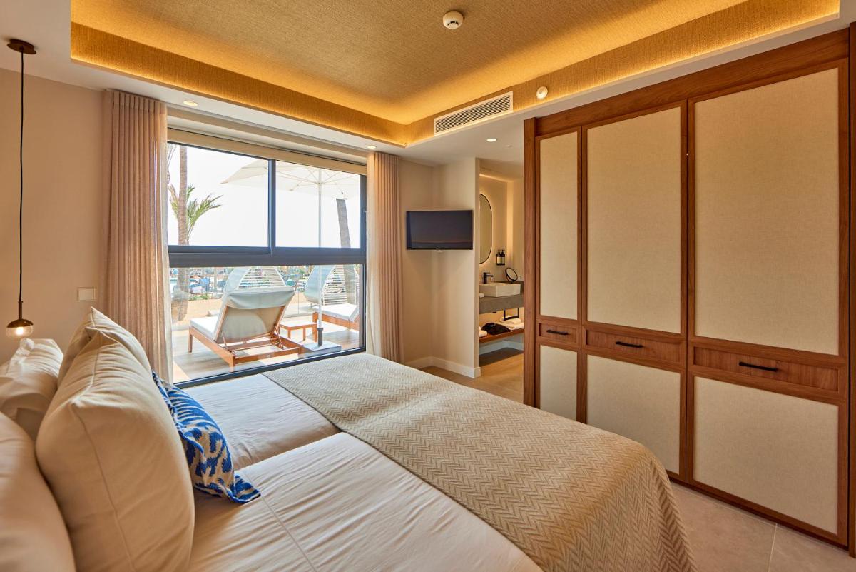Cama o camas de una habitación en Universal Grand León & Spa