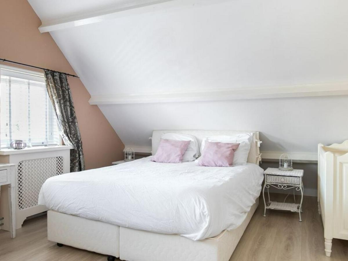 Gemütliches Ferienhaus mit beheiztem Pool, Garten und überdachter Terrasse - Housity