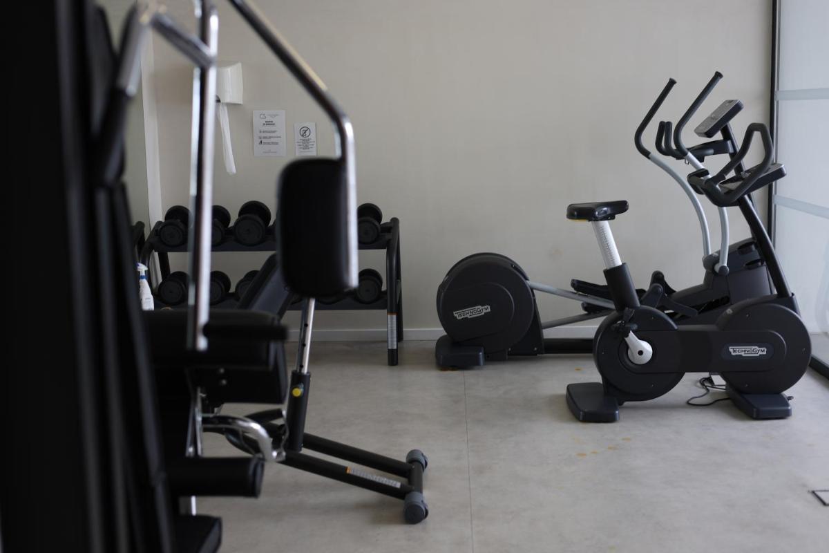 Gimnasio o instalaciones de fitness de Hotel Cala Saona & Spa