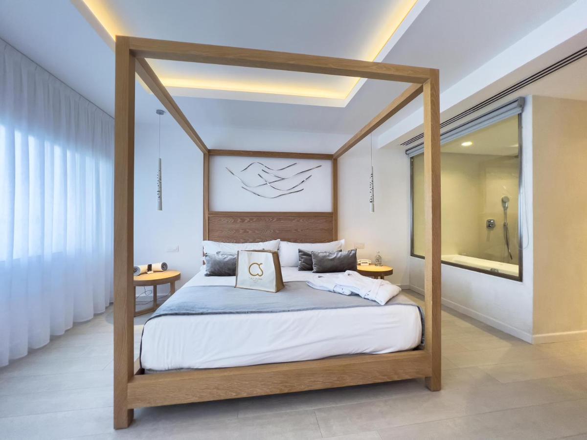 Cama o camas de una habitación en Hotel Cala Saona & Spa