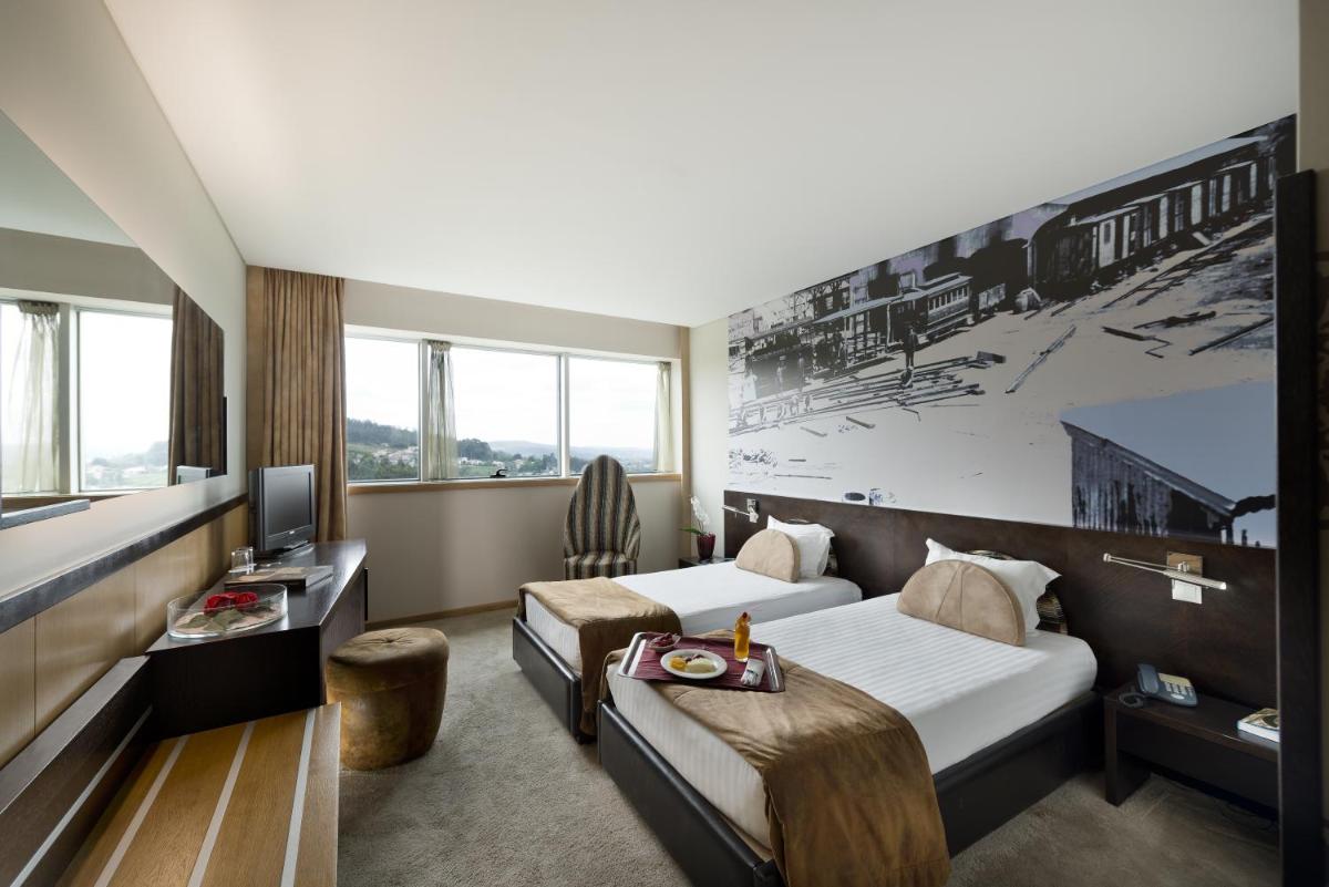 Uma cama ou camas num quarto em Penafiel Park Hotel & Spa