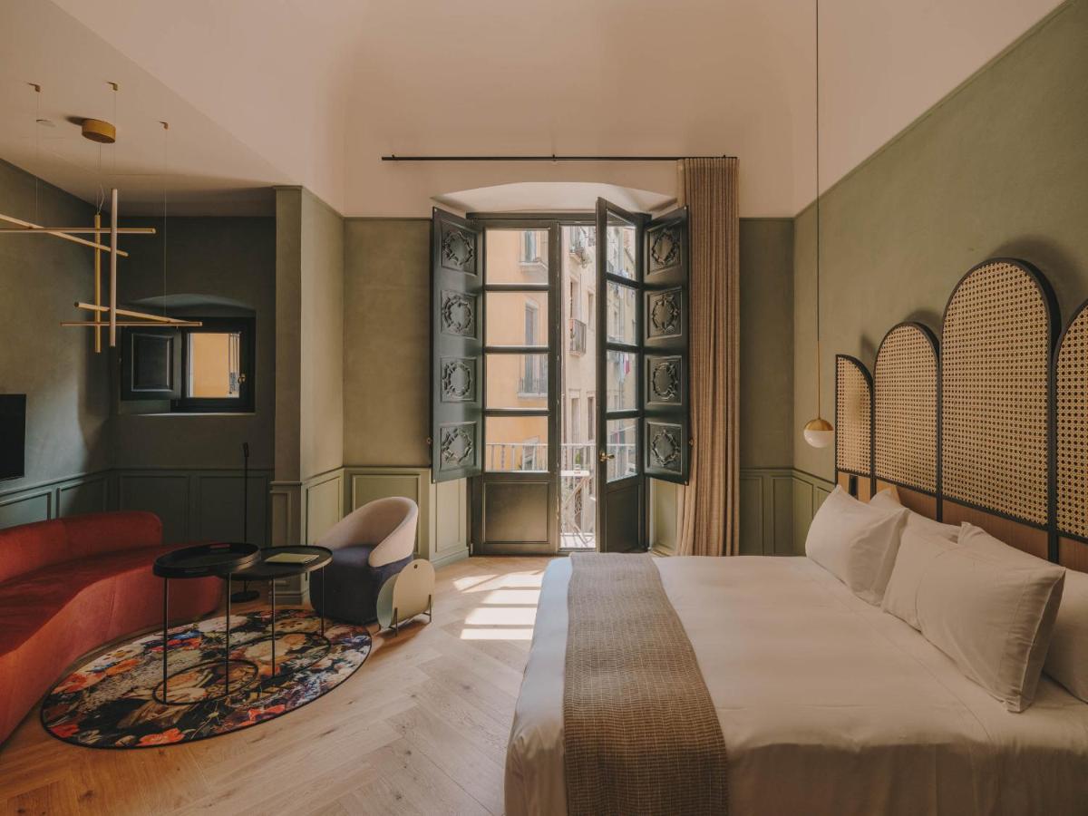 Cama o camas de una habitación en Hotel Palau Fugit