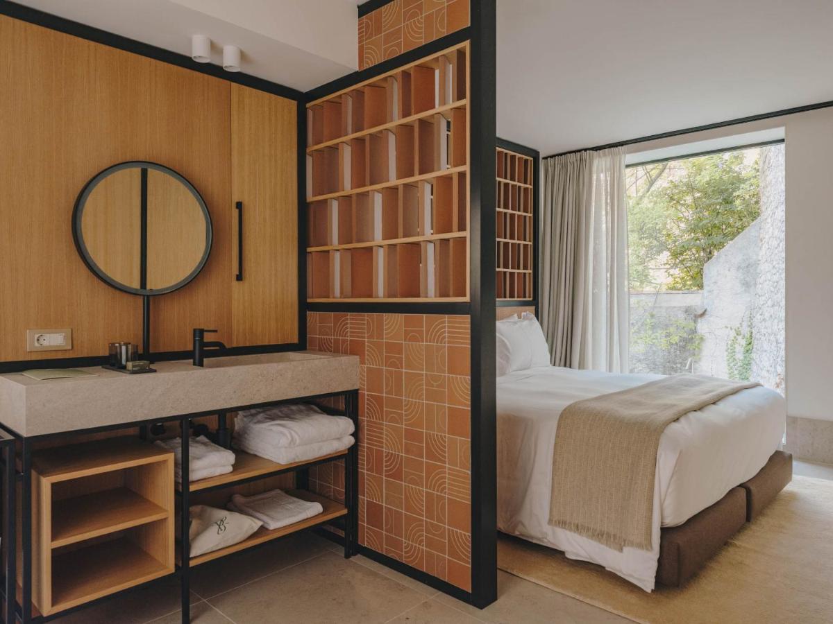 Cama o camas de una habitación en Hotel Palau Fugit