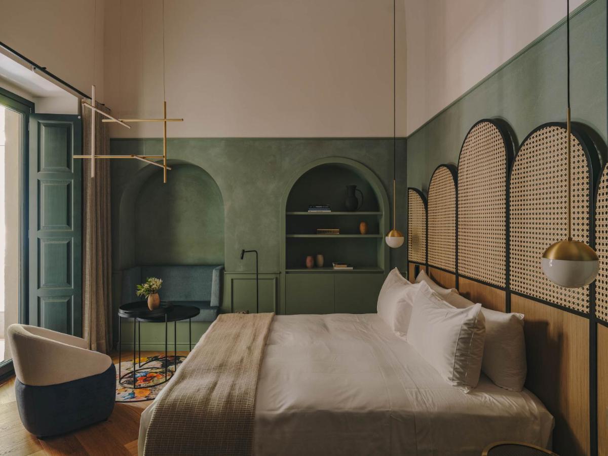Cama o camas de una habitación en Hotel Palau Fugit
