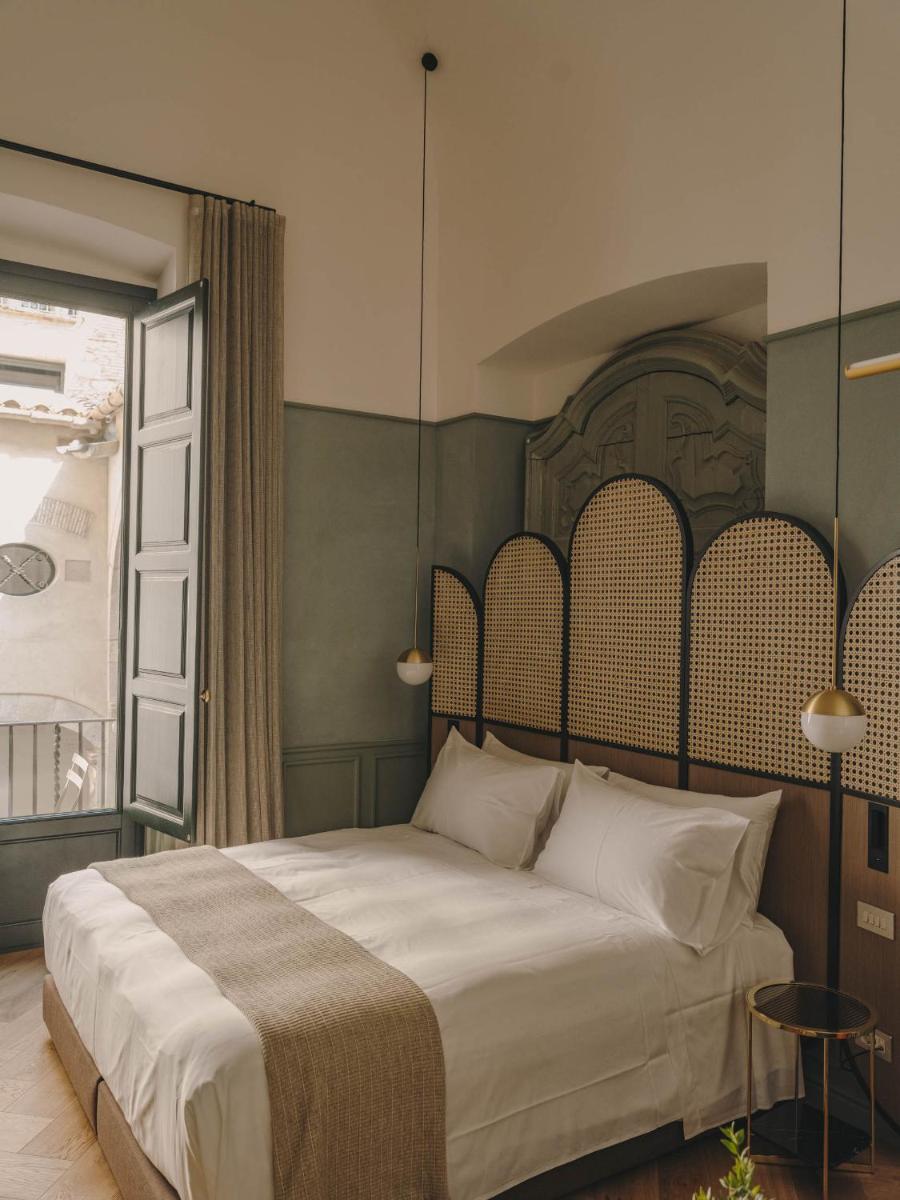 Cama o camas de una habitación en Hotel Palau Fugit