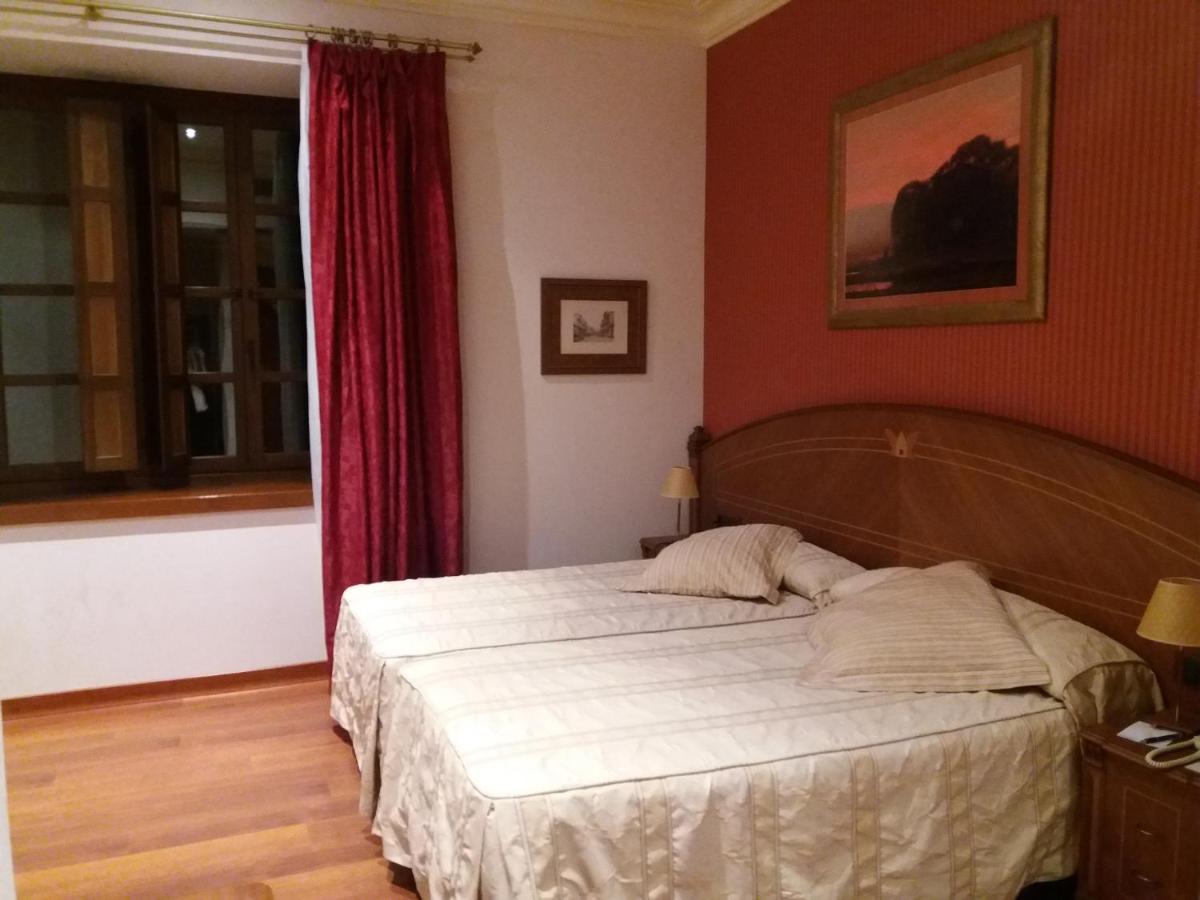 Cama o camas de una habitación en Hotel Palacio de la Magdalena