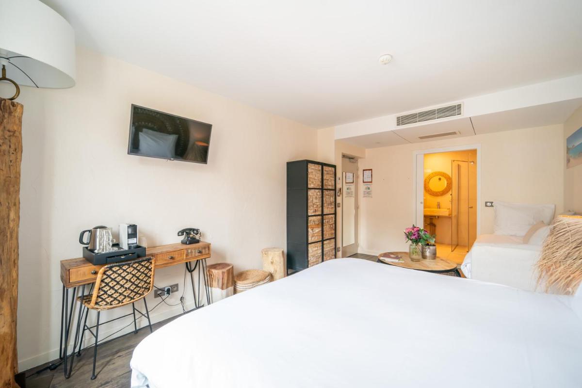 Un ou plusieurs lits dans un hébergement de l'établissement La Finca Hôtel & Spa