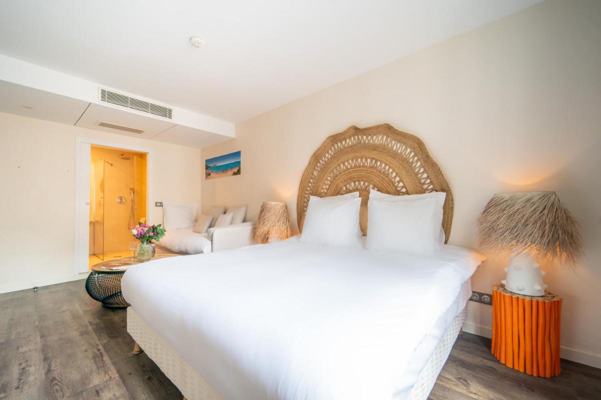 Un ou plusieurs lits dans un hébergement de l'établissement La Finca Hôtel & Spa