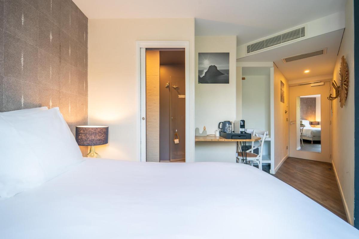 Un ou plusieurs lits dans un hébergement de l'établissement La Finca Hôtel & Spa