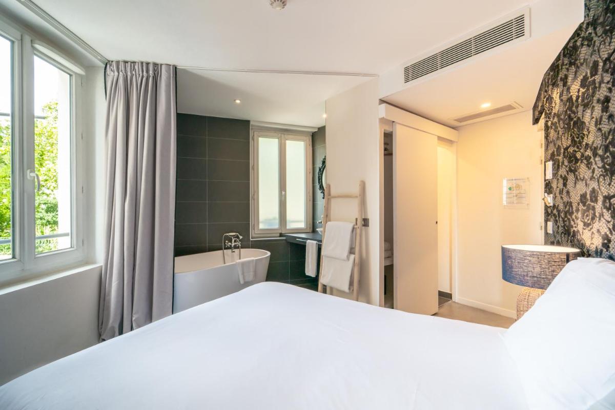 Un ou plusieurs lits dans un hébergement de l'établissement La Finca Hôtel & Spa