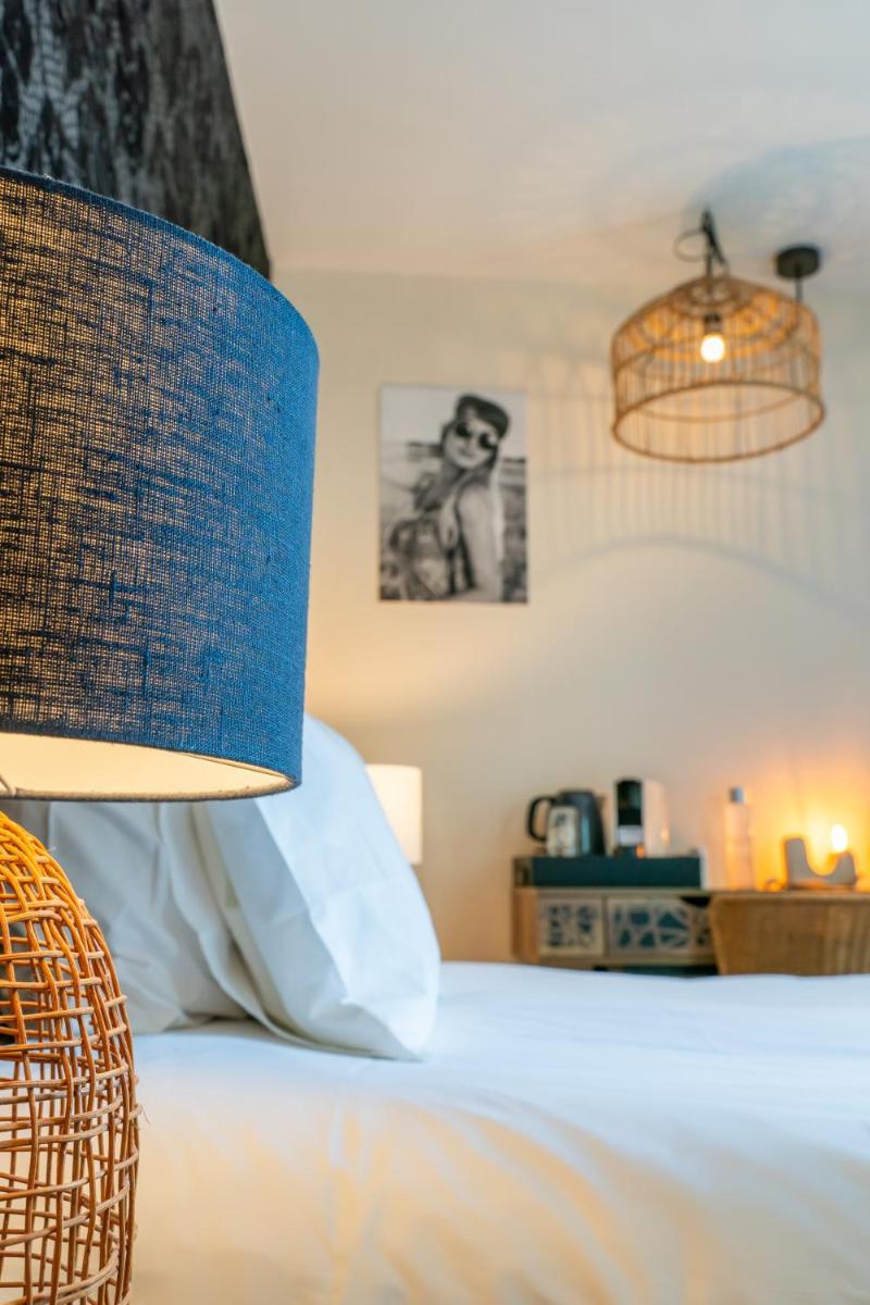 Un ou plusieurs lits dans un hébergement de l'établissement La Finca Hôtel & Spa
