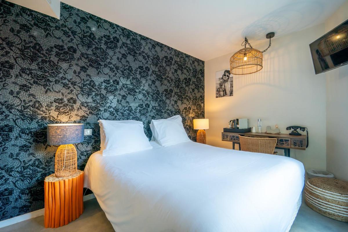 Un ou plusieurs lits dans un hébergement de l'établissement La Finca Hôtel & Spa