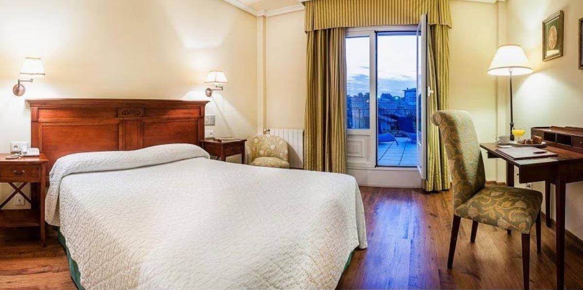 Cama o camas de una habitación en Silken Spa La Hacienda De Don Juan