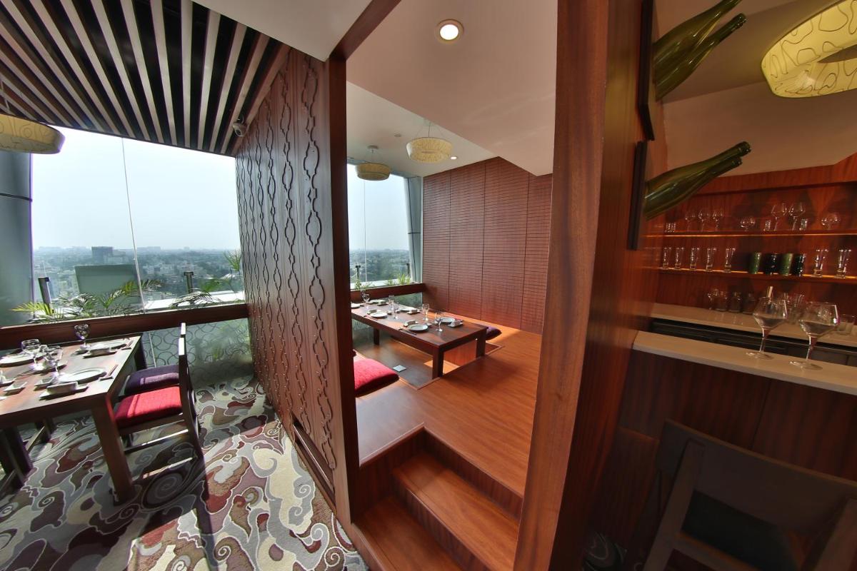 a restaurant with a dining room with a table at The Accord Metropolitan in Chennai