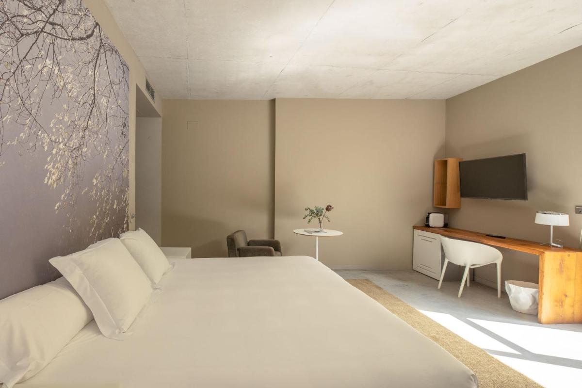 Cama o camas de una habitación en Hotel Viura