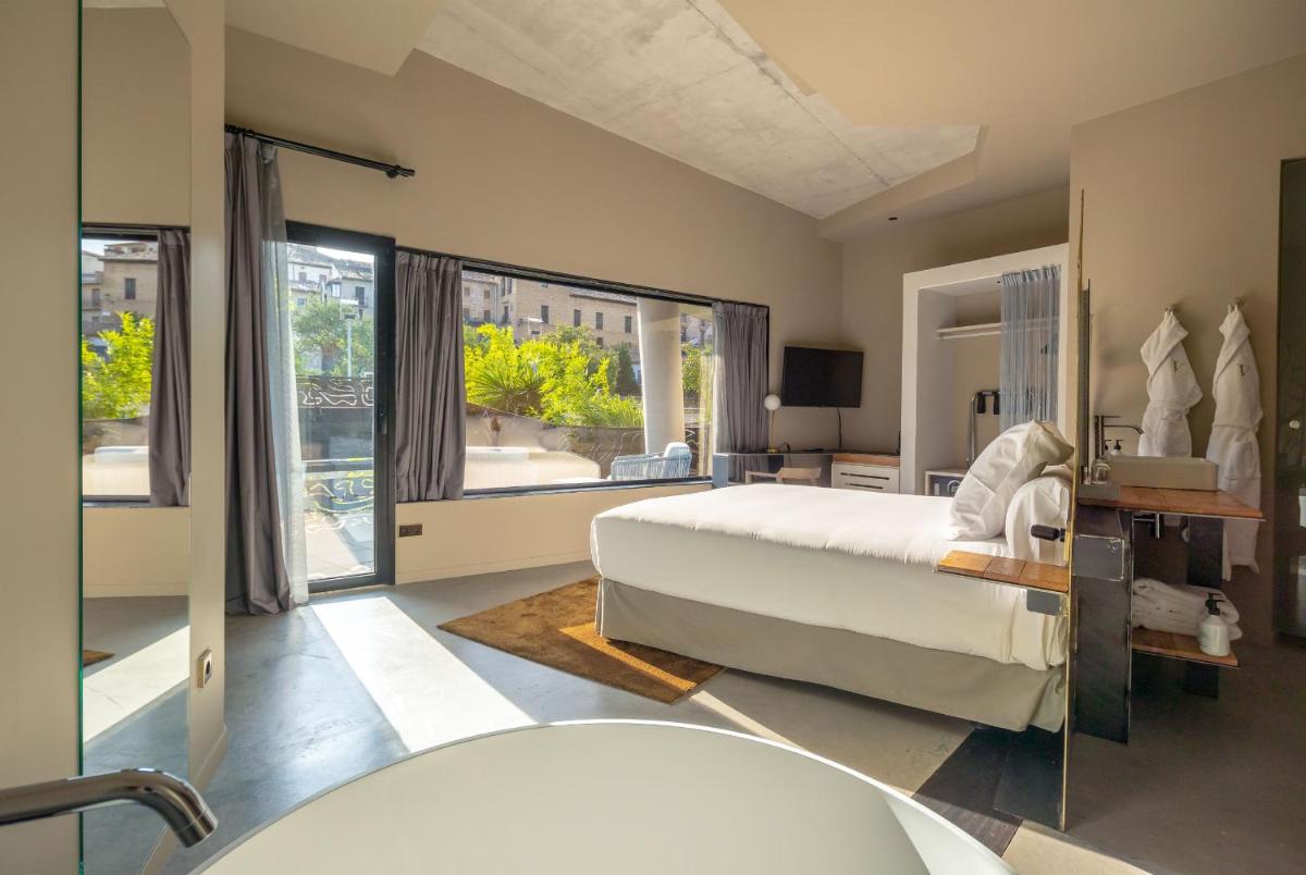 Cama o camas de una habitación en Hotel Viura