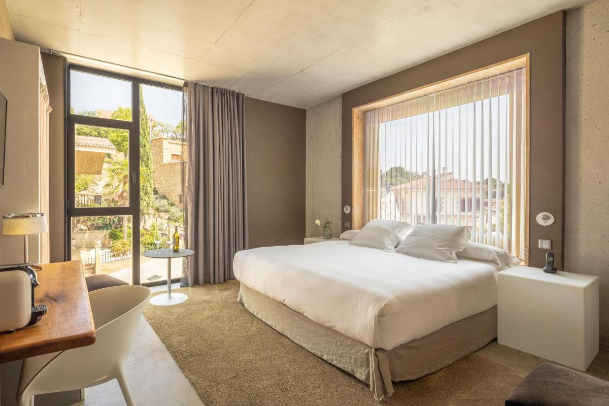 Cama o camas de una habitación en Hotel Viura