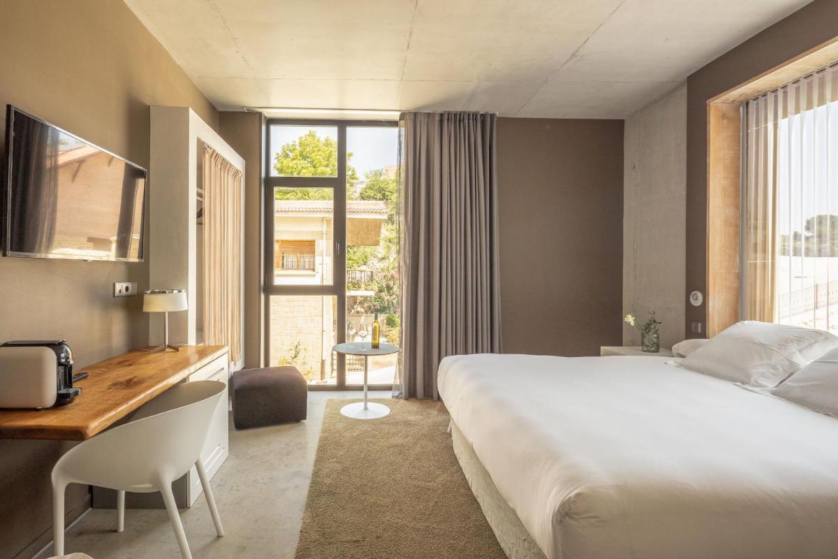 Cama o camas de una habitación en Hotel Viura
