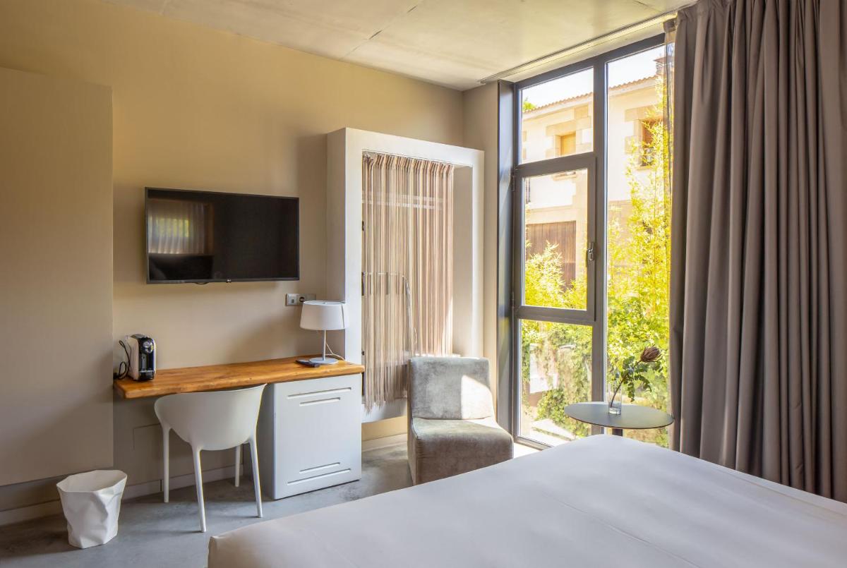 Cama o camas de una habitación en Hotel Viura
