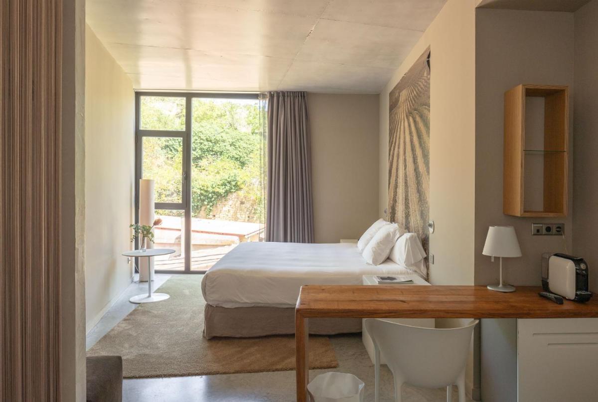 Cama o camas de una habitación en Hotel Viura